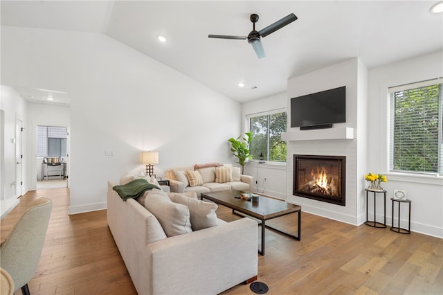 110 NE Briartown, Bentonville, AR 72712 - living room featuring a wealth of natural light, ceiling fan, light wood-type flooring, and vaulted ceiling