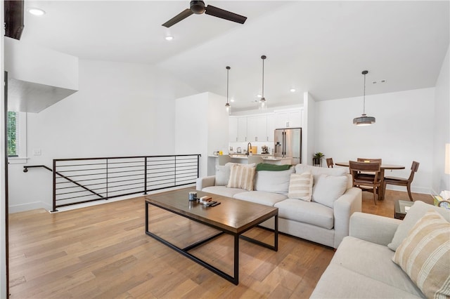 110 NE Briartown, Bentonville, AR 72712 - living room featuring ceiling fan, light hardwood / wood-style flooring, and vaulted ceiling