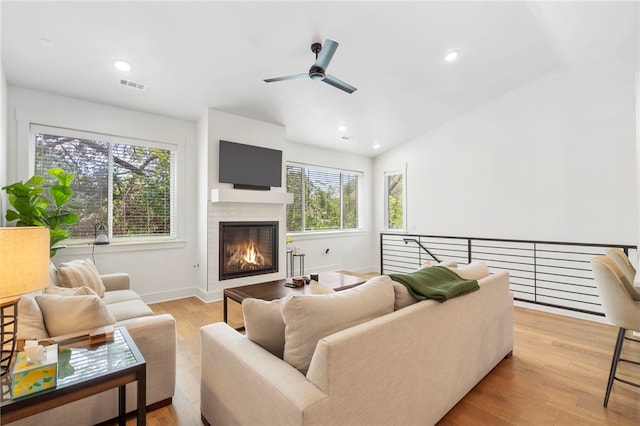 110 NE Briartown, Bentonville, AR 72712 - living room featuring ceiling fan, a healthy amount of sunlight, and light hardwood / wood-style flooring