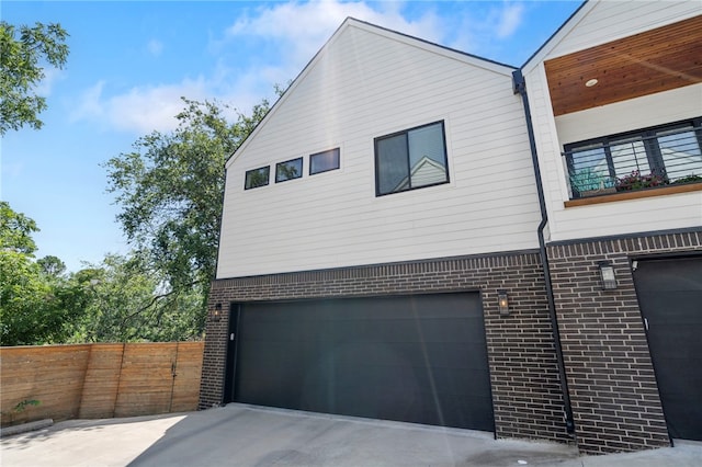 110 NE Briartown, Bentonville, AR 72712 - view of side of home with a garage