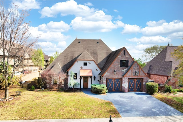 view of front facade with a garage and a front lawn