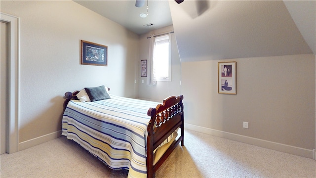 carpeted bedroom featuring lofted ceiling and ceiling fan