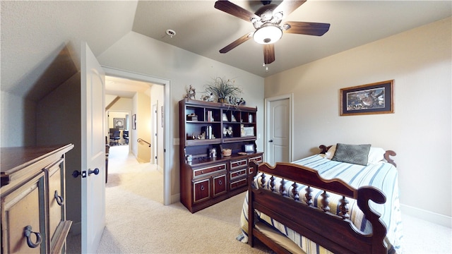 bedroom with lofted ceiling, light carpet, and ceiling fan