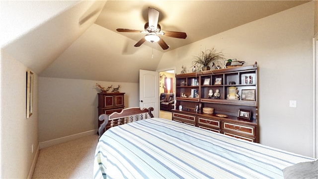 carpeted bedroom with lofted ceiling and ceiling fan