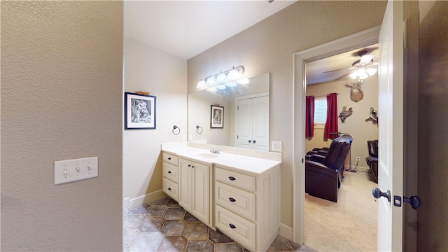 bathroom featuring ceiling fan and vanity