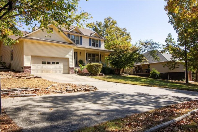 view of front of home with a garage and a porch