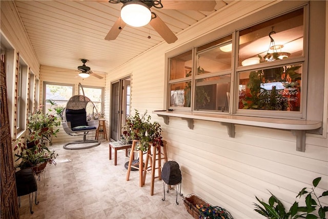 sunroom / solarium with ceiling fan