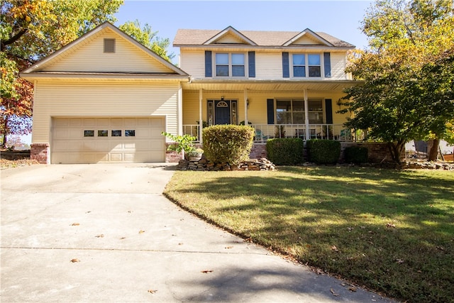 craftsman house featuring covered porch, a garage, and a front lawn