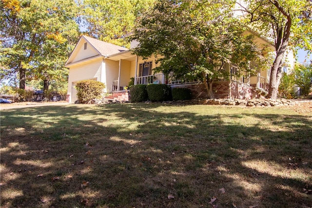 view of front of home featuring a front yard and a porch