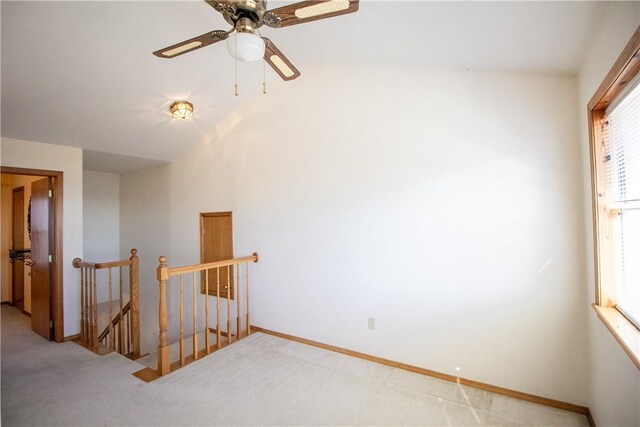 empty room with ceiling fan and carpet flooring