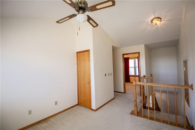 interior space featuring high vaulted ceiling and light carpet