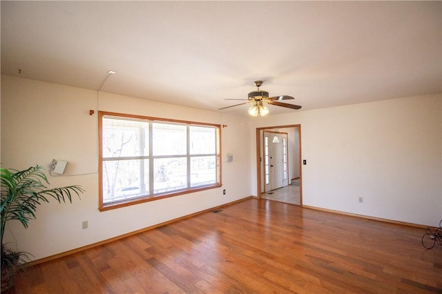 unfurnished room featuring light hardwood / wood-style flooring and ceiling fan