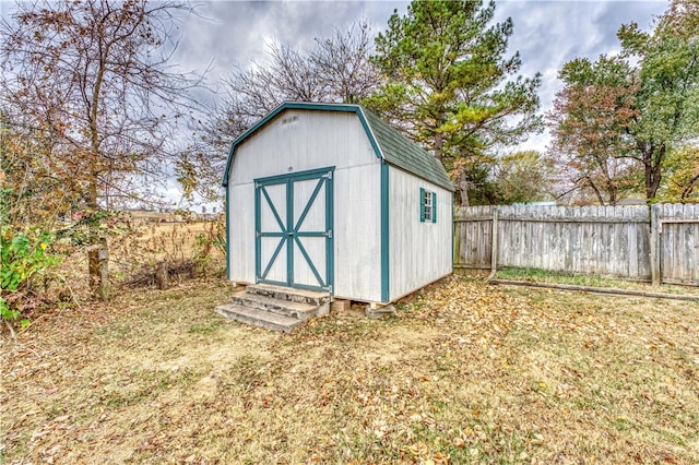 view of outbuilding featuring a yard