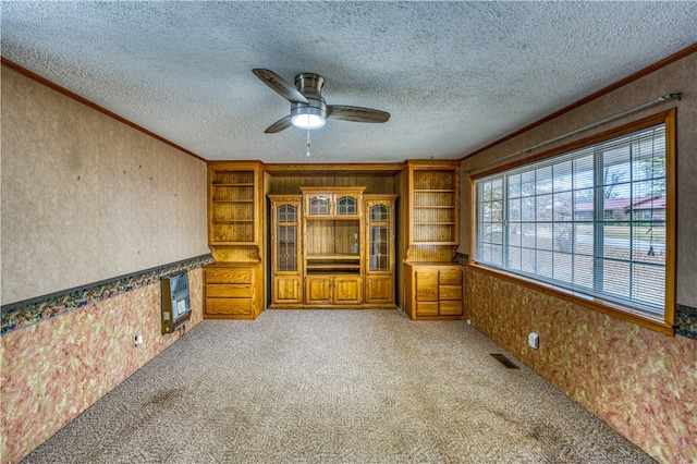 unfurnished living room featuring a textured ceiling, light carpet, and ceiling fan