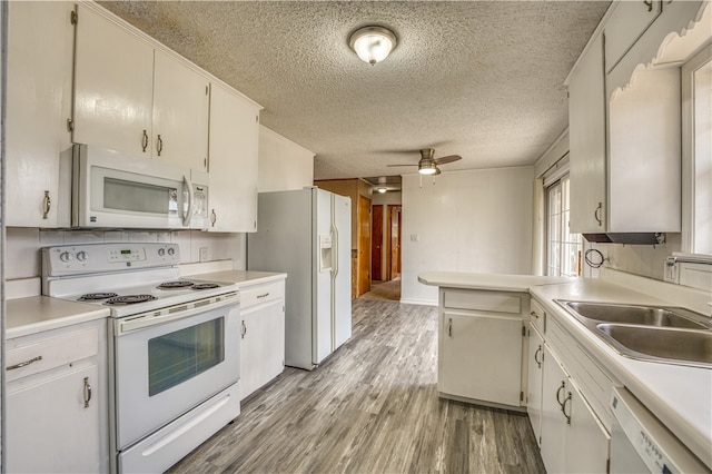 kitchen featuring a textured ceiling, ceiling fan, white cabinetry, light wood-type flooring, and white appliances