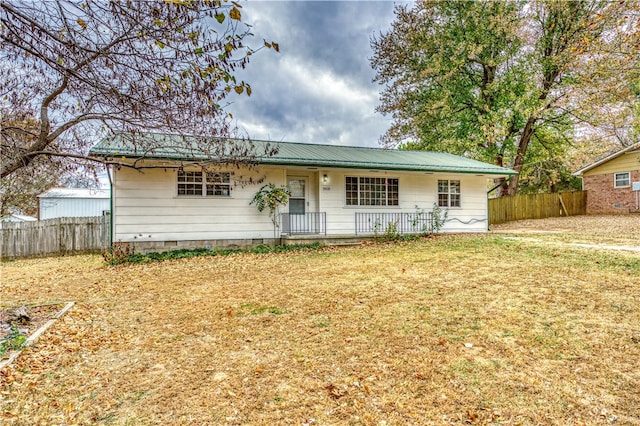 ranch-style home with a porch and a front lawn