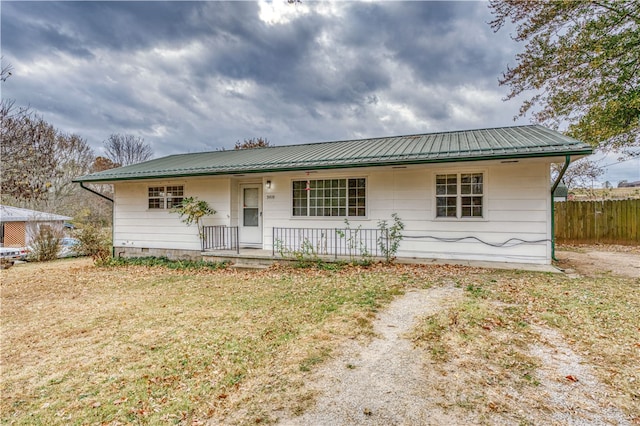 view of front of home with a porch and a front lawn