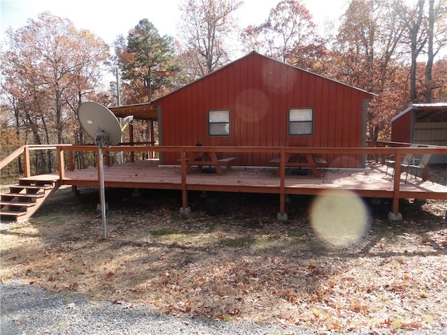 back of property with a wooden deck