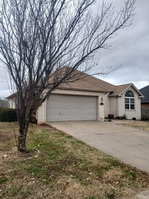 single story home with a garage