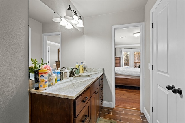 bathroom featuring vanity and wood-type flooring