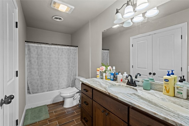 full bathroom with vanity, toilet, and shower / tub combo with curtain