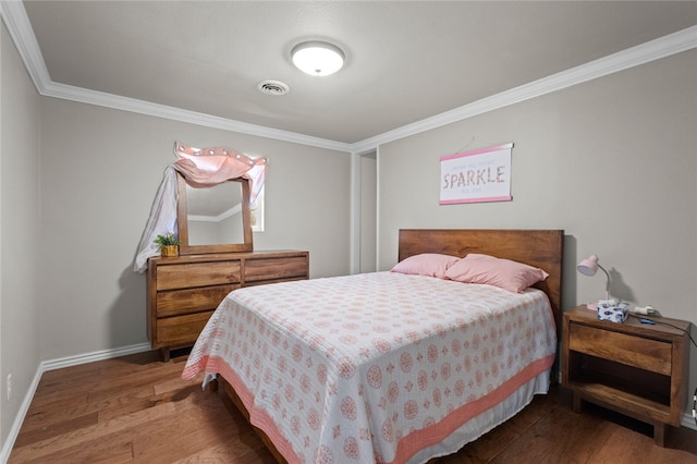 bedroom with ornamental molding and wood-type flooring