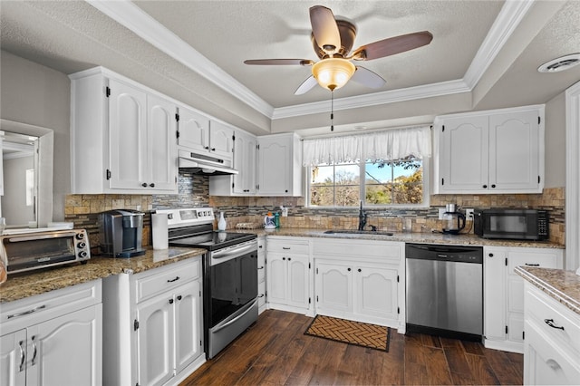 kitchen featuring stainless steel appliances, white cabinets, sink, and ornamental molding