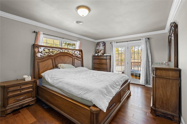 bedroom featuring access to exterior, dark hardwood / wood-style flooring, multiple windows, and crown molding