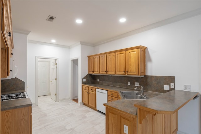 kitchen featuring sink, kitchen peninsula, ornamental molding, white appliances, and decorative backsplash