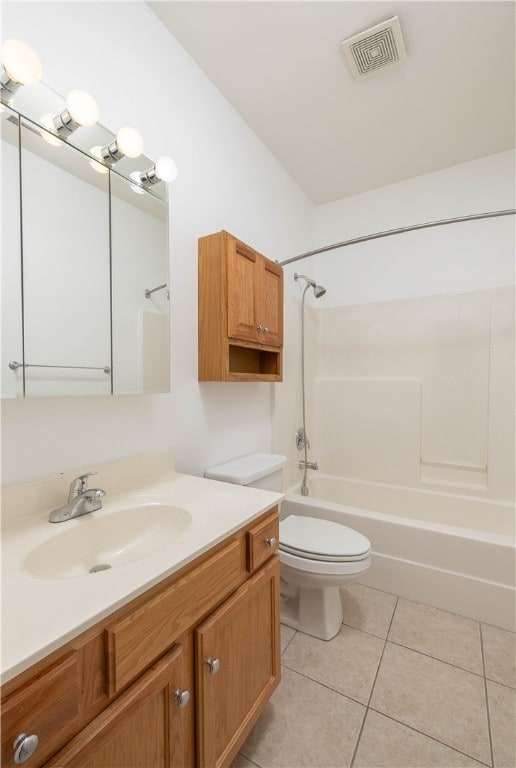 full bathroom with tile patterned flooring, washtub / shower combination, toilet, and vanity