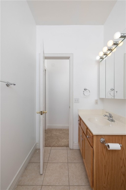 bathroom featuring tile patterned flooring and vanity