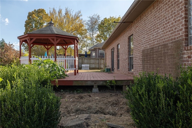 wooden deck featuring a gazebo