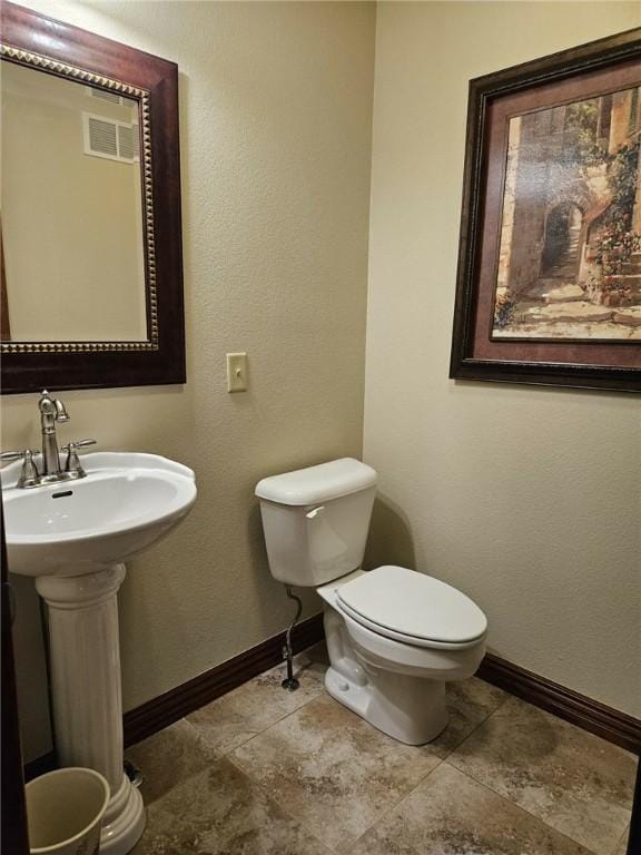 bathroom featuring sink and toilet