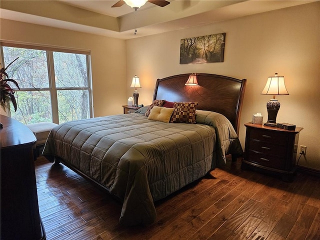 bedroom featuring ceiling fan and dark hardwood / wood-style floors