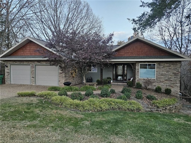 view of front of property featuring a garage and a front lawn