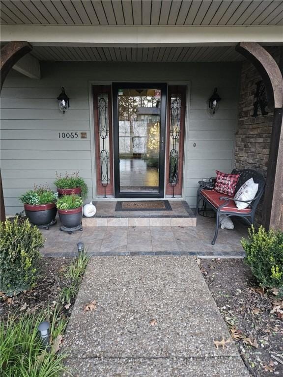 doorway to property featuring a porch