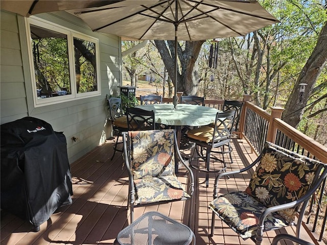 wooden terrace featuring area for grilling