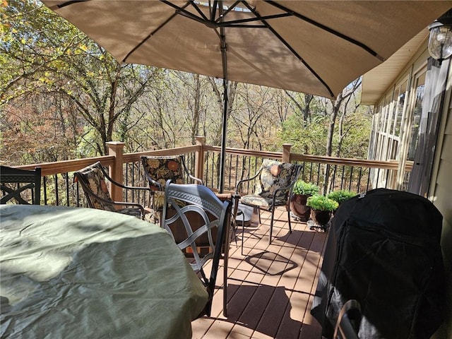 wooden deck featuring grilling area