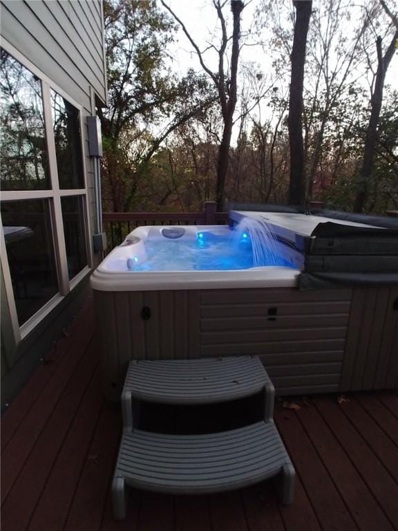 deck with a hot tub