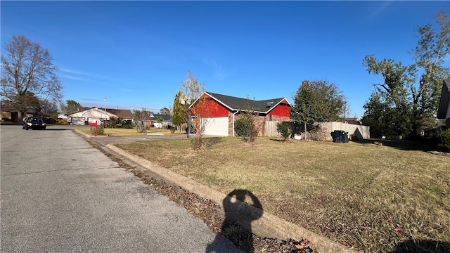 view of front of house with a garage and a front yard