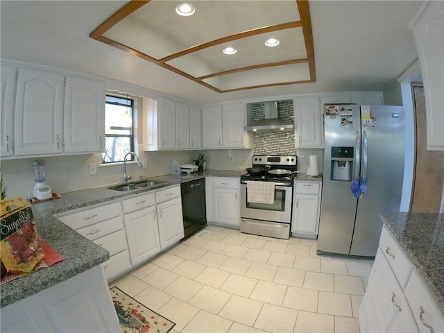 kitchen featuring white cabinets, stainless steel appliances, and wall chimney exhaust hood