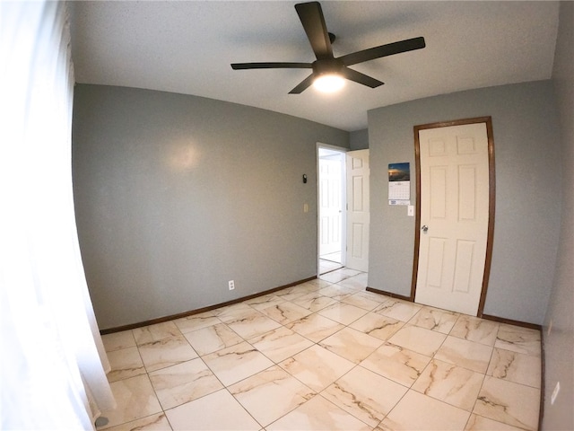 unfurnished room with ceiling fan