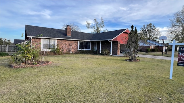 ranch-style home with a front lawn