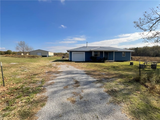 view of front of house with a front lawn and a garage