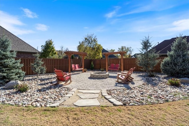 1303 NW Hermanus St, Bentonville, AR 72712 - view of yard featuring fence, an outdoor fire pit, and a patio area