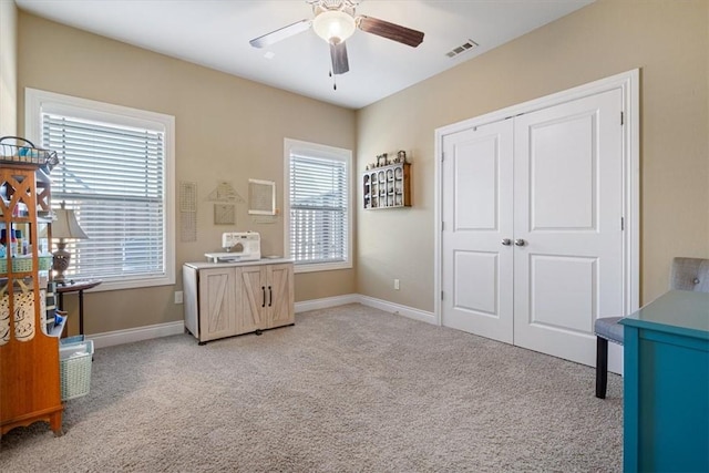 1303 NW Hermanus St, Bentonville, AR 72712 - bedroom featuring baseboards, light colored carpet, visible vents, and a closet