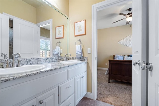 1303 NW Hermanus St, Bentonville, AR 72712 - bathroom featuring double vanity, a ceiling fan, a sink, and ensuite bathroom