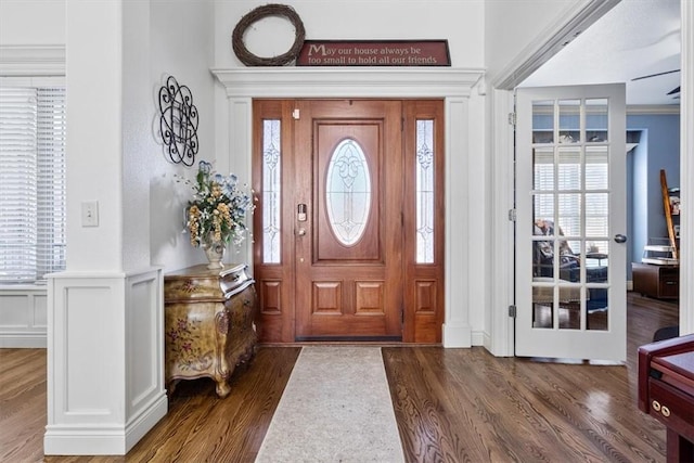 1303 NW Hermanus St, Bentonville, AR 72712 - entryway with dark wood-style flooring, a decorative wall, a wealth of natural light, and a wainscoted wall