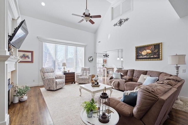 1303 NW Hermanus St, Bentonville, AR 72712 - living area with a fireplace, high vaulted ceiling, a ceiling fan, baseboards, and wood finished floors