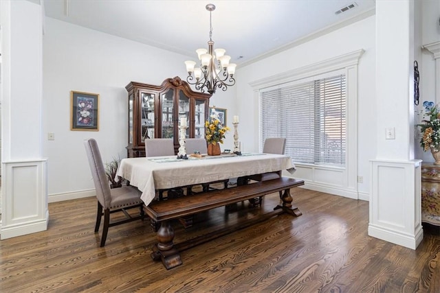 1303 NW Hermanus St, Bentonville, AR 72712 - dining room featuring ornamental molding, a chandelier, wood finished floors, and visible vents